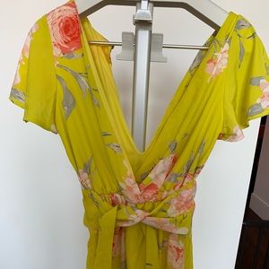 Well used womens bright yellow romper